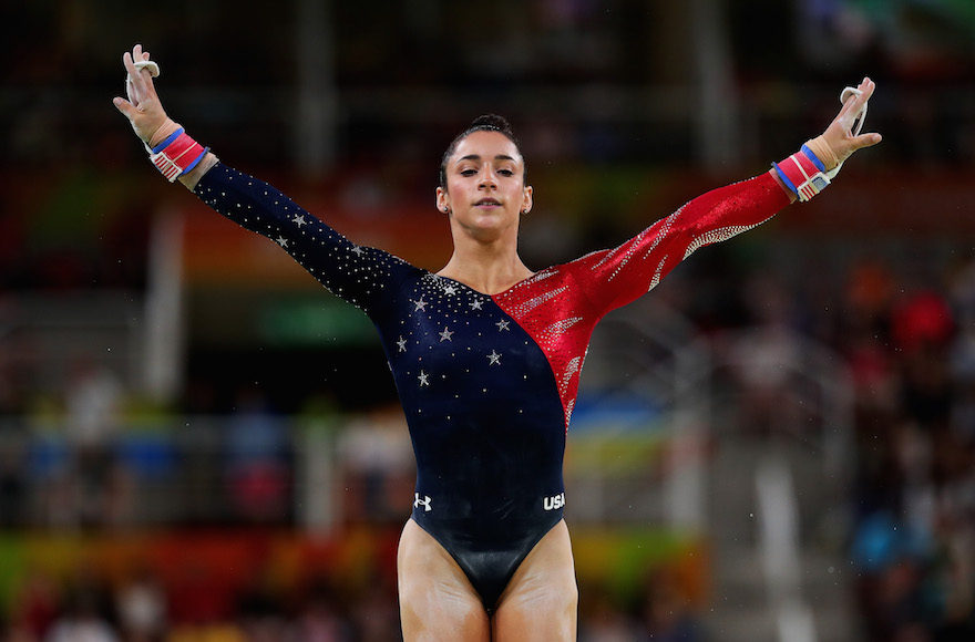 Aly Raisman competing on the uneven bars on the second day of the Rio 2016 Olympic Games at the Rio Olympic Arena, Aug. 7, 2016. (Tom Pennington/Getty Images)